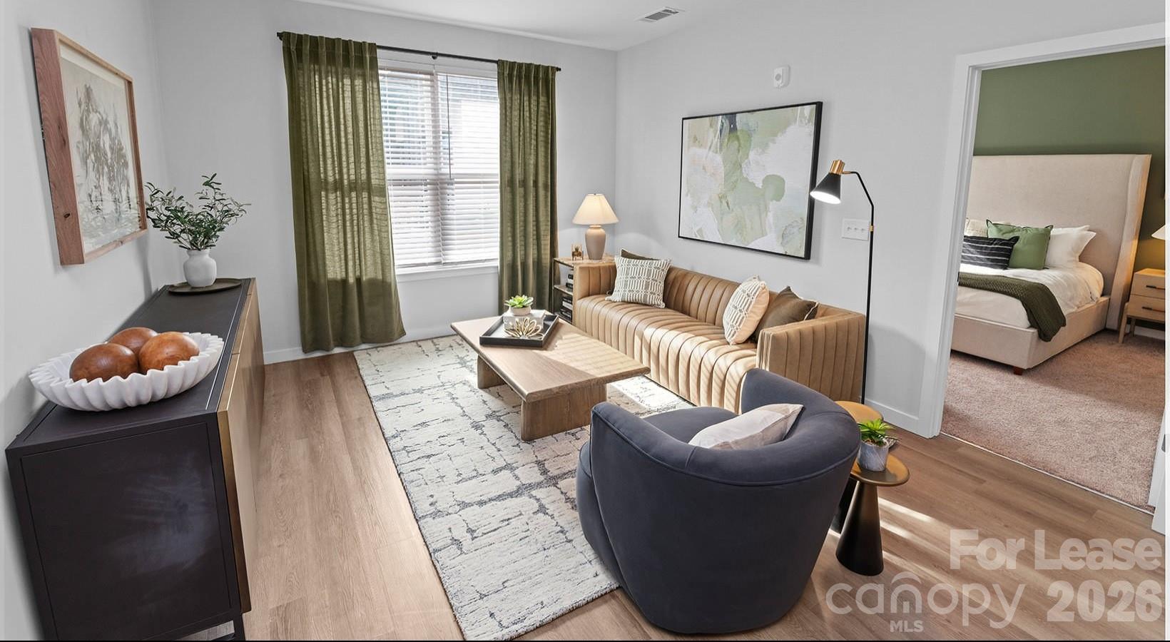 2546 Perimeter Pointe Parkway, Unit 1G Charlotte, NC 28208 - Photo 39 of 48 a living room with furniture and a window