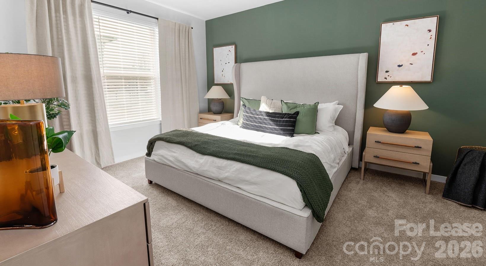 2546 Perimeter Pointe Parkway, Unit 1G Charlotte, NC 28208 - Photo 41 of 48 a spacious bedroom with a bed and a flat tv screen on dresser