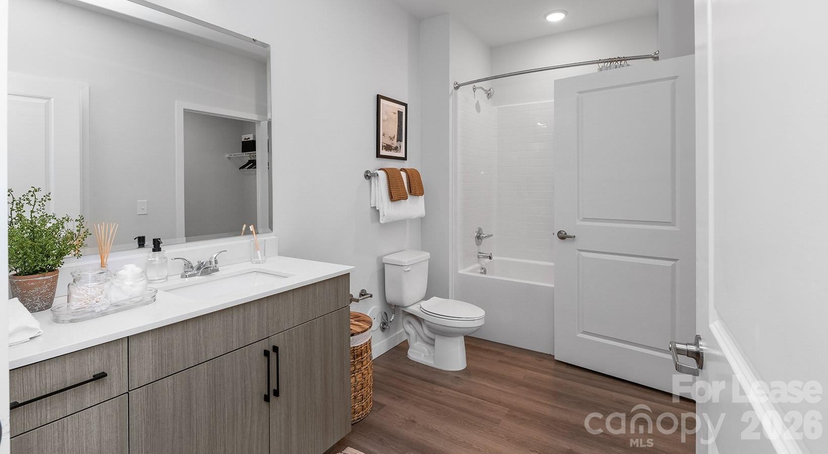 2546 Perimeter Pointe Parkway, Unit 1G Charlotte, NC 28208 - Photo 43 of 48 a bathroom with a sink a toilet and shower