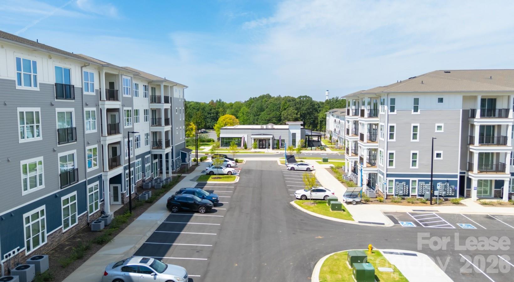 2546 Perimeter Pointe Parkway, Unit 1G Charlotte, NC 28208 - Photo 48 of 48 a view of a building with a swimming pool