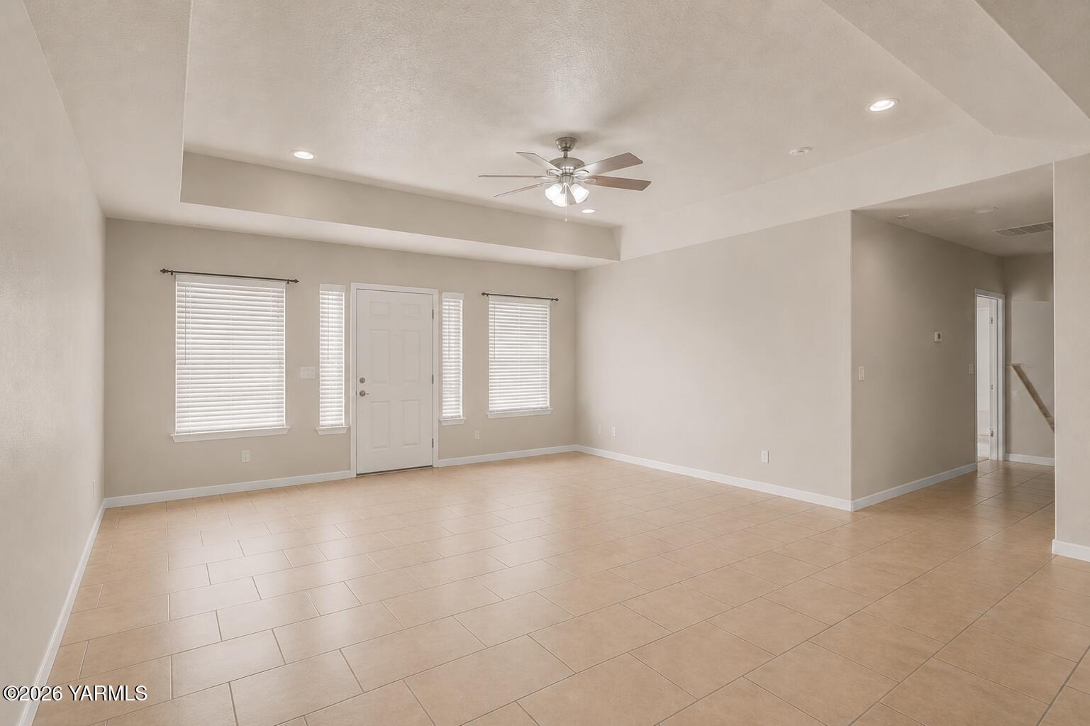 1811 Beam Road Granger, WA 98932 - Photo 9 of 26 wooden floor in an empty room with a window