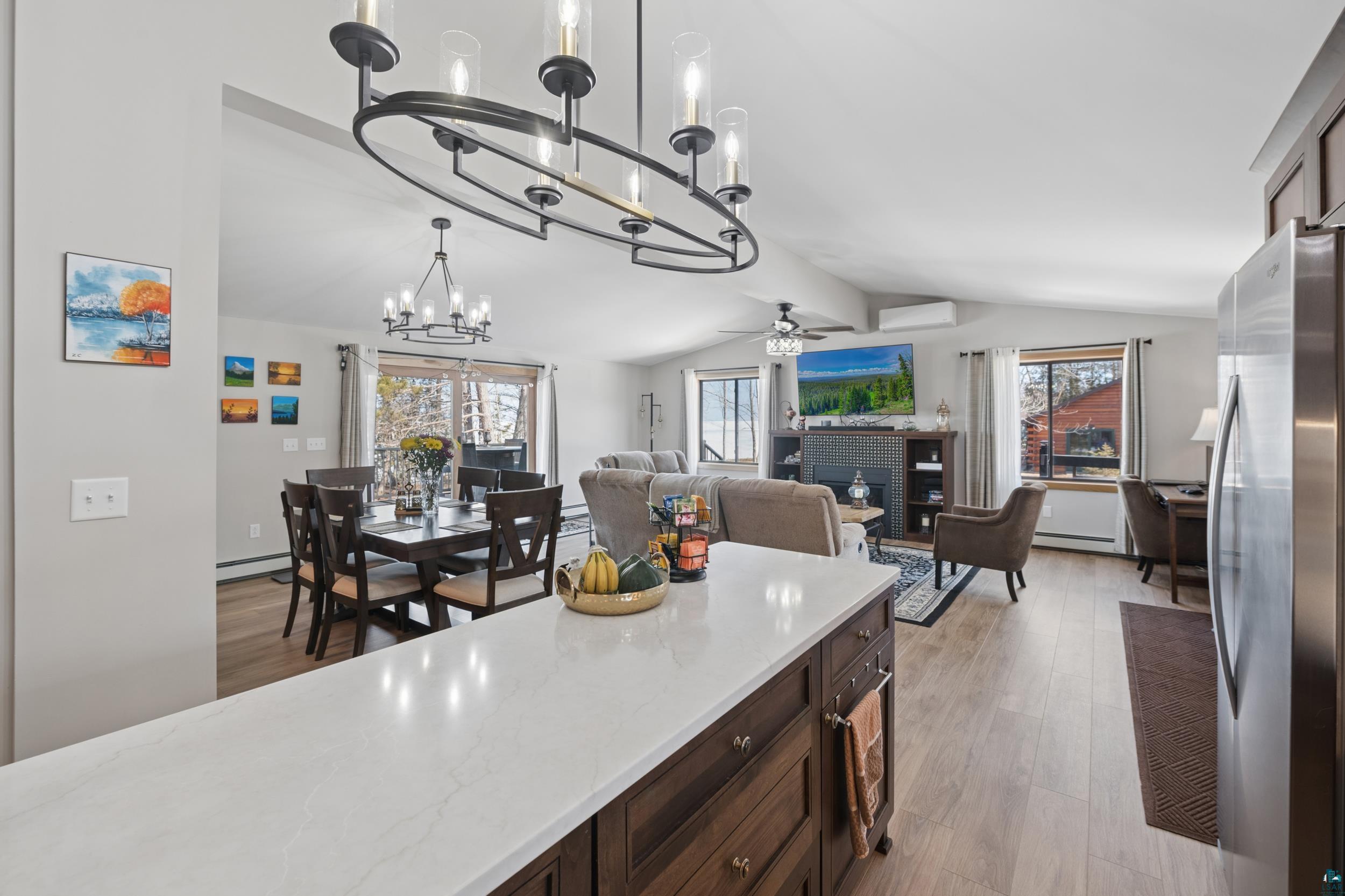 3903 Lake Park Road Ashland, WI 54806 - Photo 37 of 37 Kitchen with ceiling fan, freestanding refrigerator, light wood-style floors, dark wood finish cabinets, and open floor plan