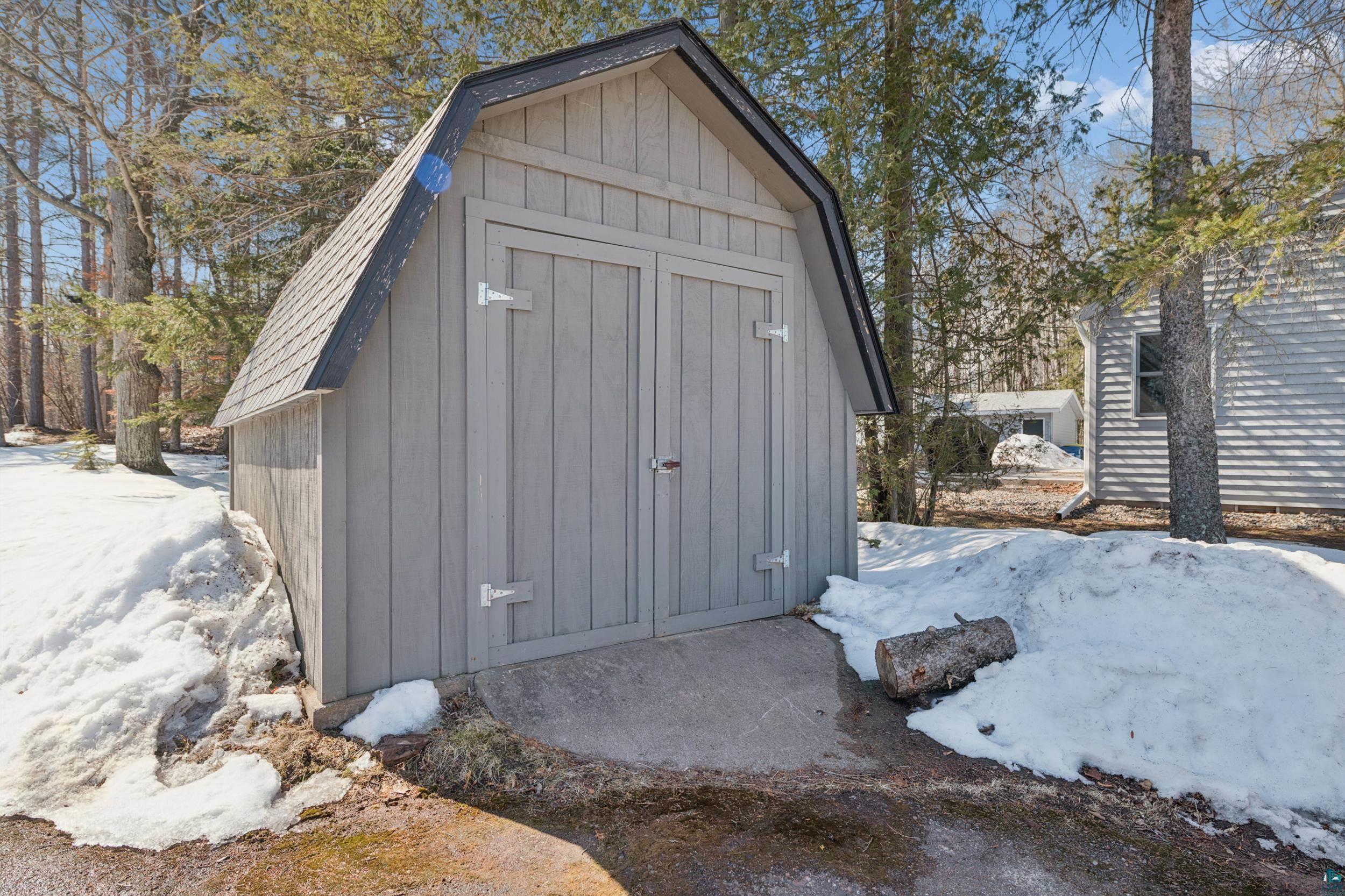 3903 Lake Park Road Ashland, WI 54806 - Photo 34 of 37 Snow covered structure with a shed