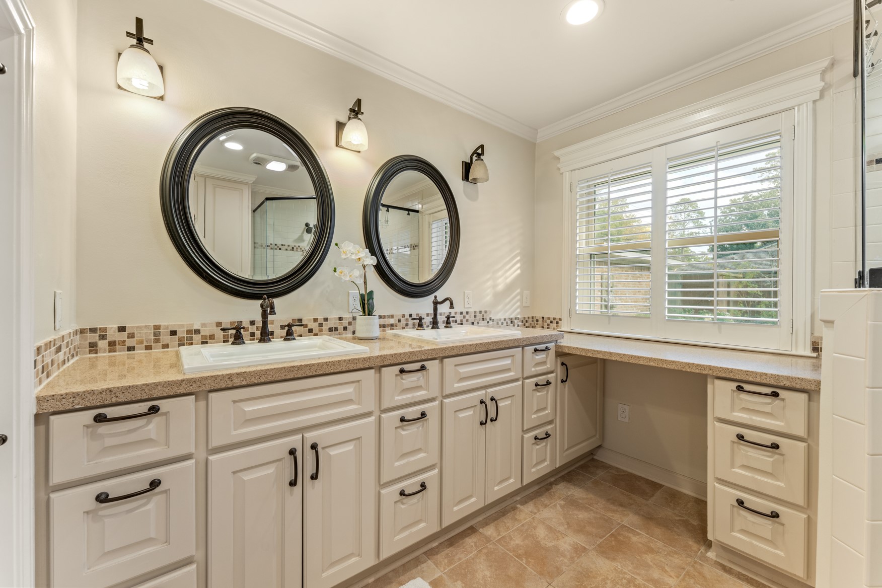 10203 Green Tree Road Houston, TX 77042 - Photo 9 of 28 Upgraded primary bath boasts tons of storage, double sinks, vanity, and private water closet.