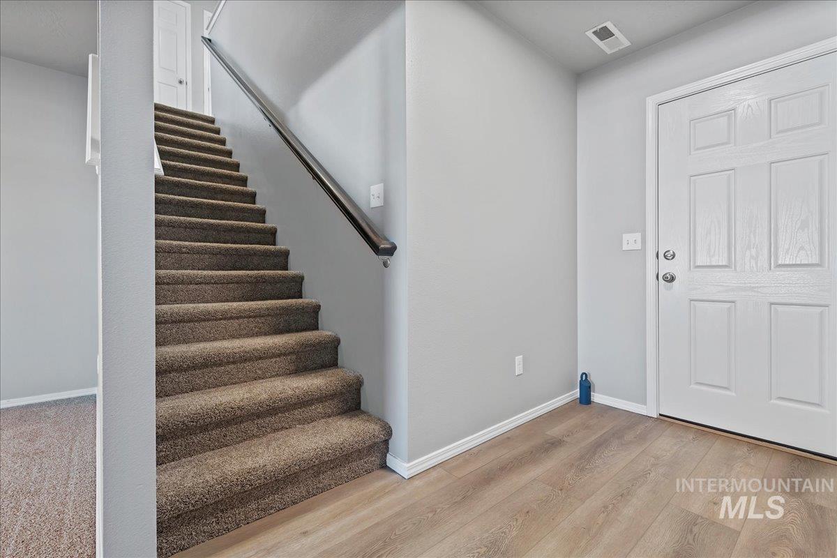 916 West Woodpine Street Meridian, ID 83646 - Photo 16 of 32 Entrance foyer with light wood-type flooring and stairs