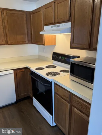 a kitchen with a stove and a microwave