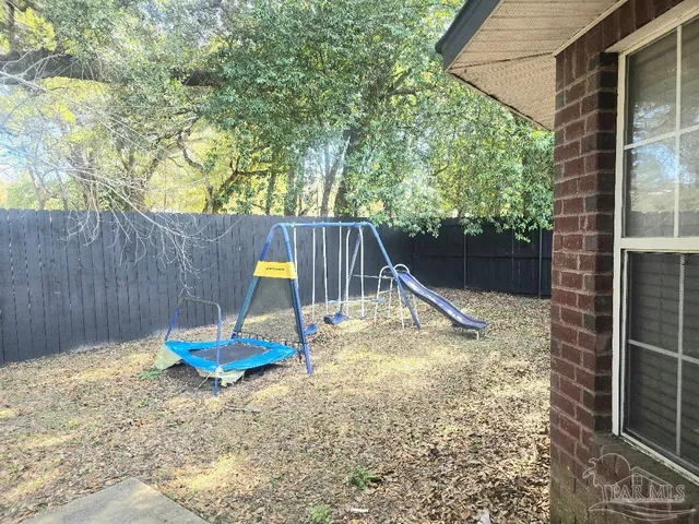a view of back yard of the house