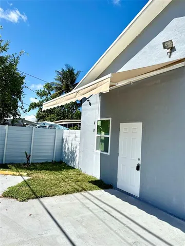 a view of a backyard of the house