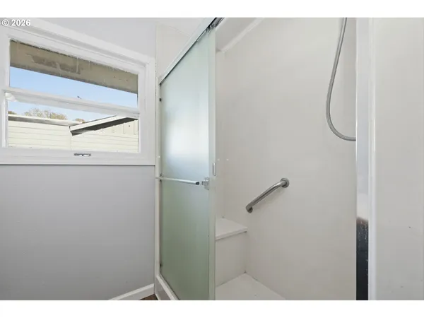 a bathroom with a sink vanity and a mirror