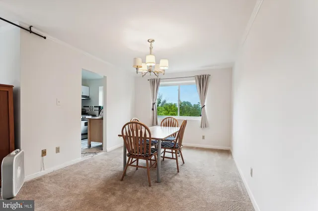 a kitchen with a stove top oven and refrigerator