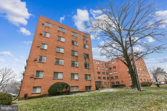 a view of a livingroom with furniture and a window