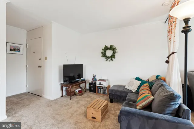 a bedroom with furniture and a chandelier