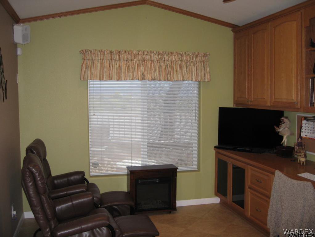 1905 Victoria Farms Road, Unit 83 Lake Havasu City, AZ 86404 - Photo 11 of 30 a living room with furniture and a flat screen tv