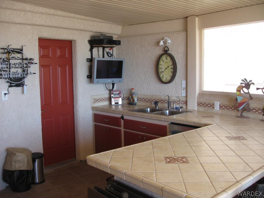 1905 Victoria Farms Road, Unit 83 Lake Havasu City, AZ 86404 - Photo 15 of 30 a room with two chairs and a table
