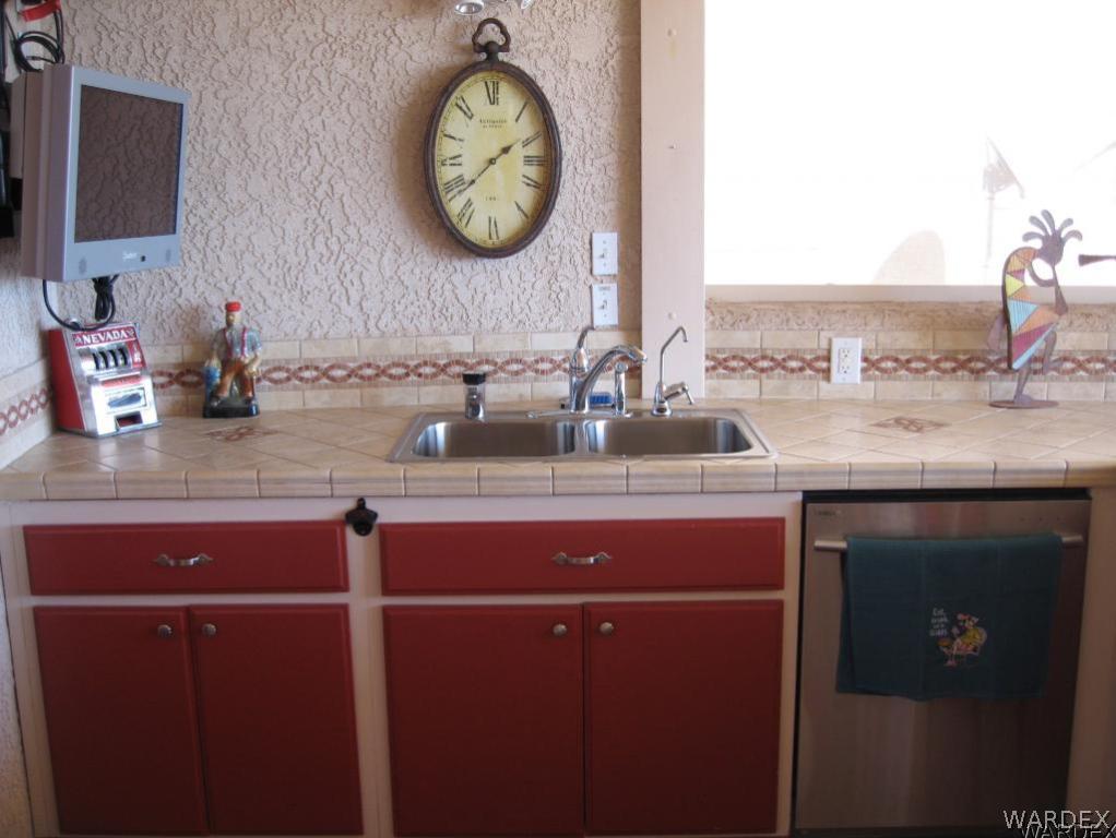 1905 Victoria Farms Road, Unit 83 Lake Havasu City, AZ 86404 - Photo 17 of 30 a room with a sink and a mirror