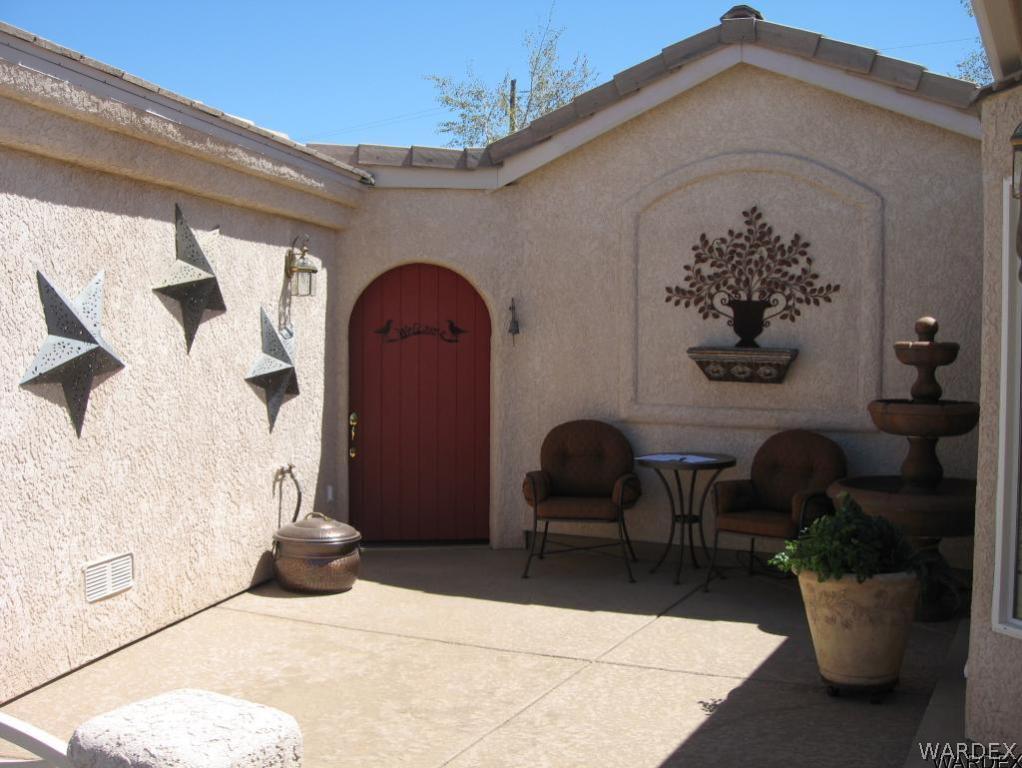 1905 Victoria Farms Road, Unit 83 Lake Havasu City, AZ 86404 - Photo 2 of 30 a view of a two chairs in a patio