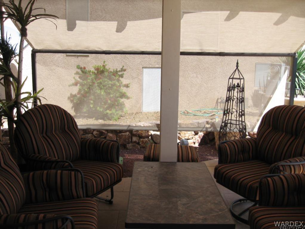 1905 Victoria Farms Road, Unit 83 Lake Havasu City, AZ 86404 - Photo 24 of 30 a living room with furniture and a large window