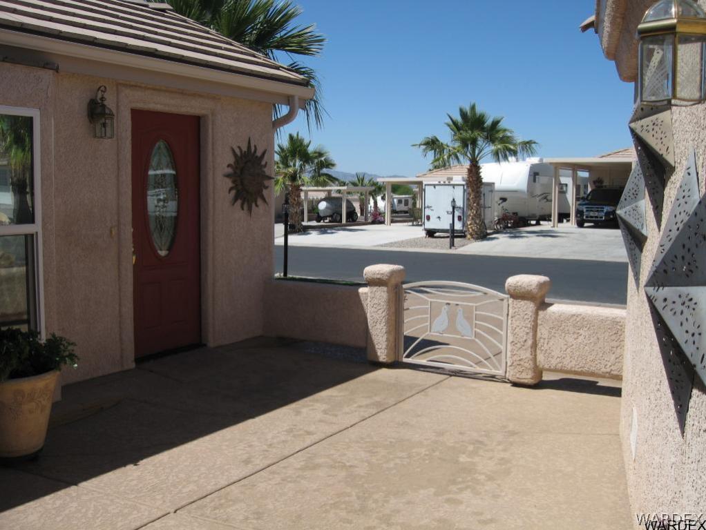1905 Victoria Farms Road, Unit 83 Lake Havasu City, AZ 86404 - Photo 28 of 30 a swimming pool with outdoor seating and yard