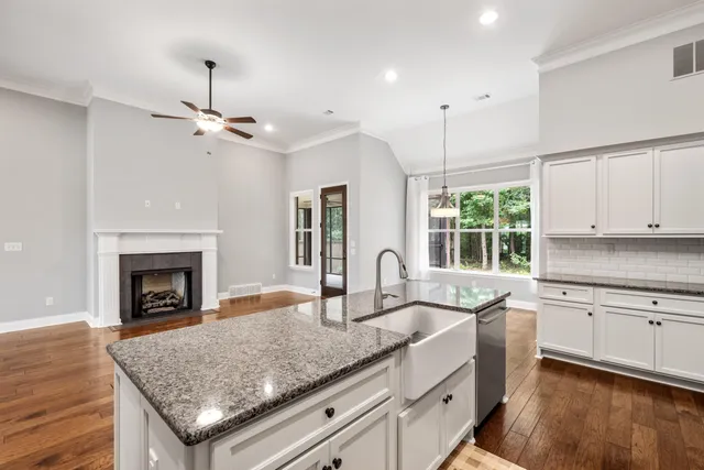 a kitchen with sink and cabinets