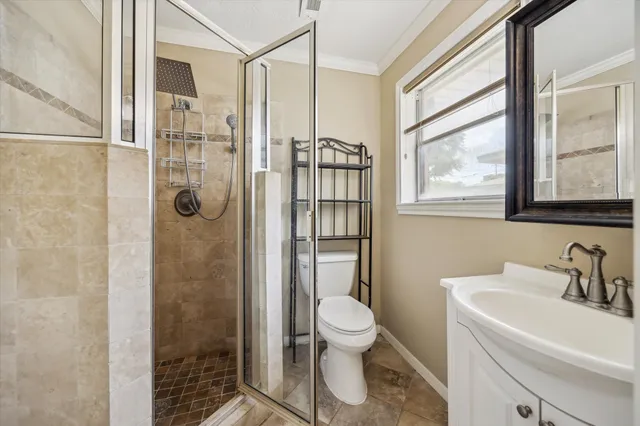 a bathroom with a toilet sink and shower