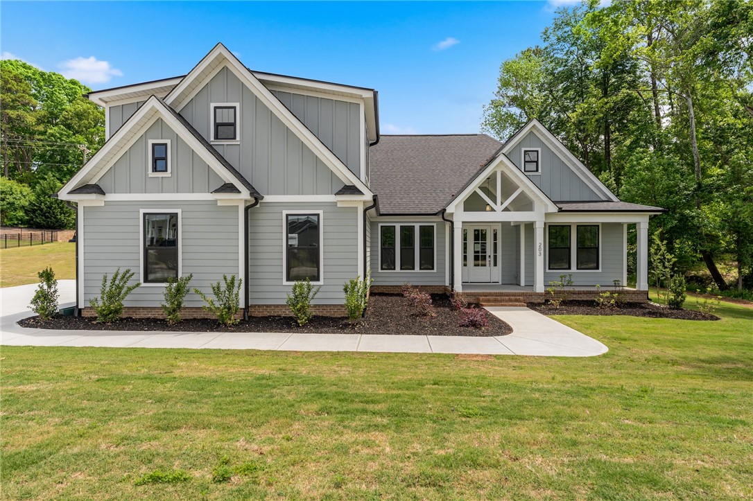 203 Timothy Court Anderson, SC 29621 - Photo 24 of 40 A welcoming facade showcases a classic gable roofline and a charming front porch.