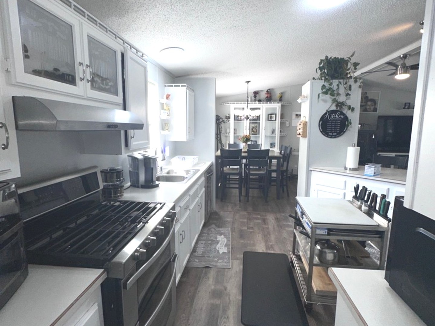201 Greenview Road Belvidere, IL 61008 - Photo 11 of 57 a kitchen with a stove and a wooden floor