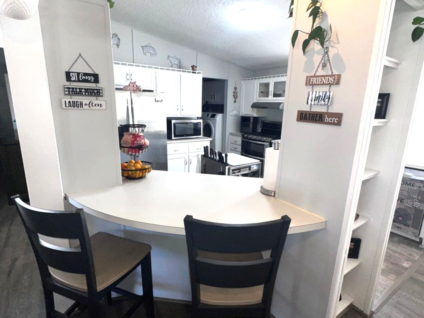 201 Greenview Road Belvidere, IL 61008 - Photo 14 of 57 a kitchen with stainless steel appliances a dining table a microwave a refrigerator and cabinets