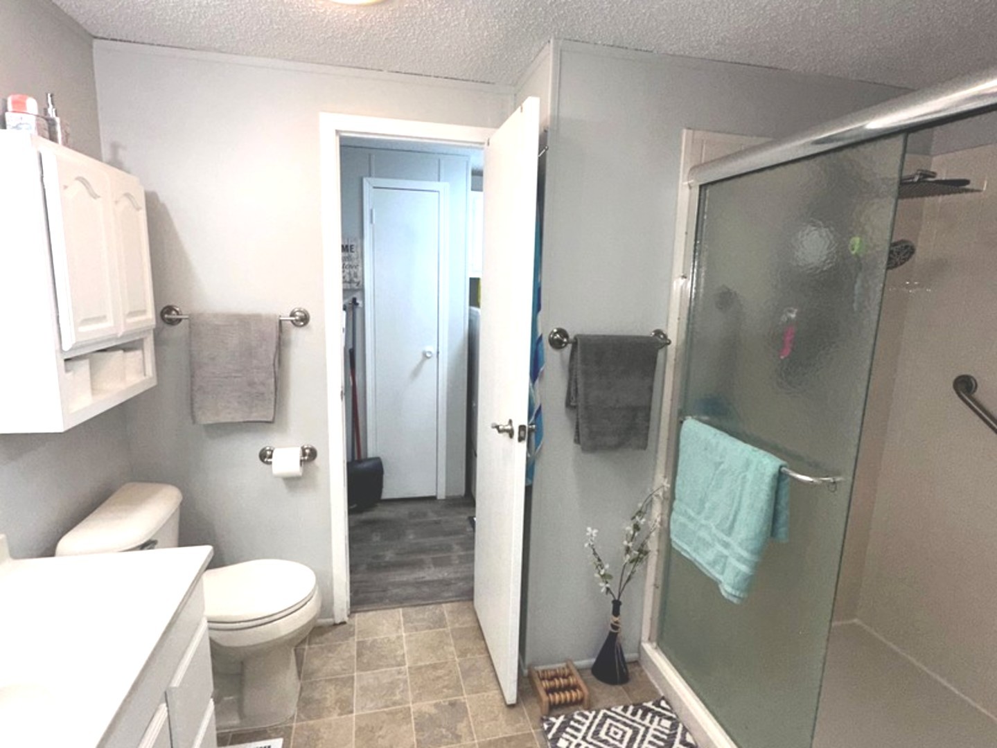 201 Greenview Road Belvidere, IL 61008 - Photo 19 of 57 a white toilet sitting next to a bathroom sink and a shower