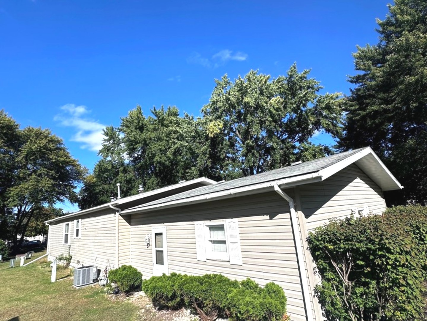 201 Greenview Road Belvidere, IL 61008 - Photo 48 of 57 a view of a white house with a yard