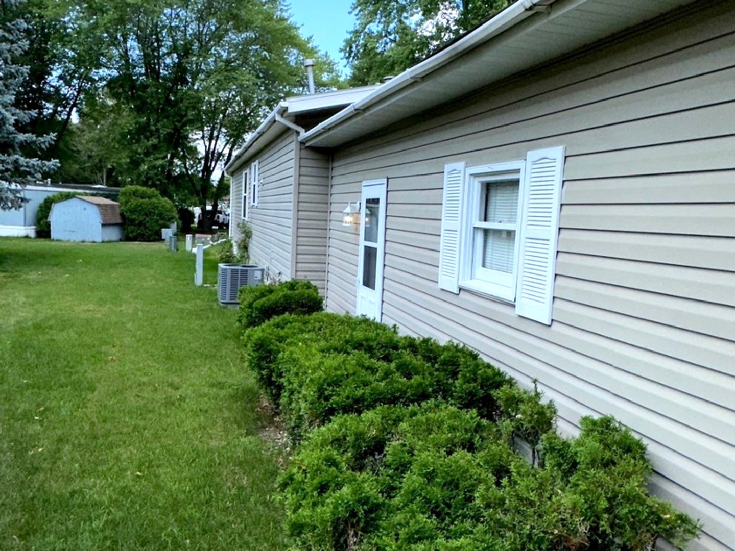 201 Greenview Road Belvidere, IL 61008 - Photo 49 of 57 a backyard of a house with plants and barbeque oven