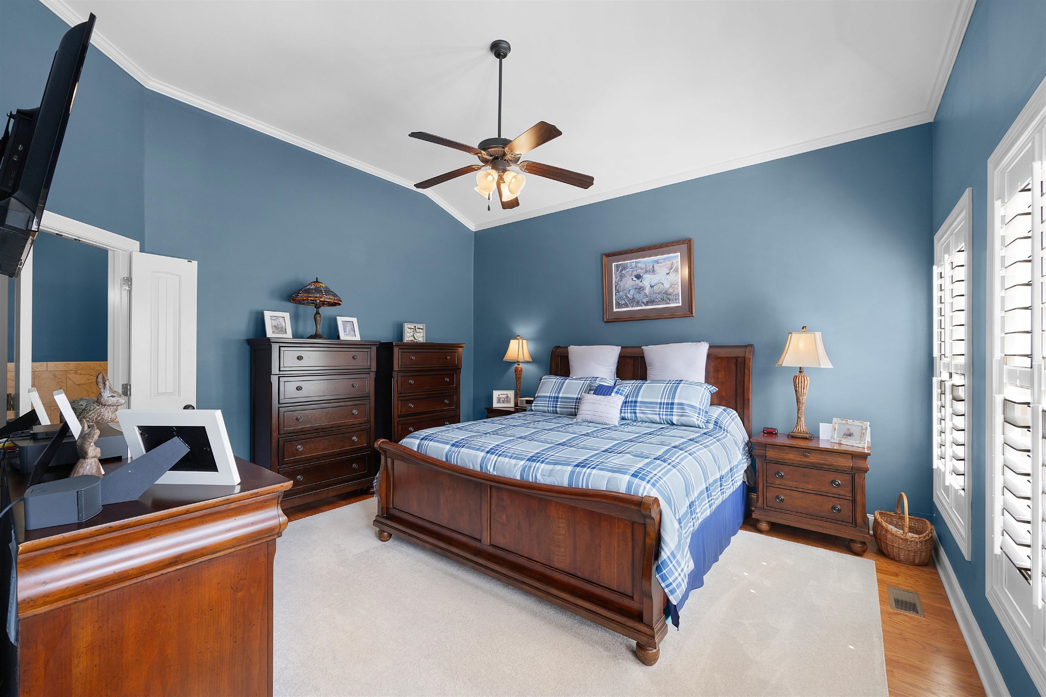 145 Deer Path Savannah, TN 38372 - Photo 12 of 23 a bedroom with a bed and a chandelier