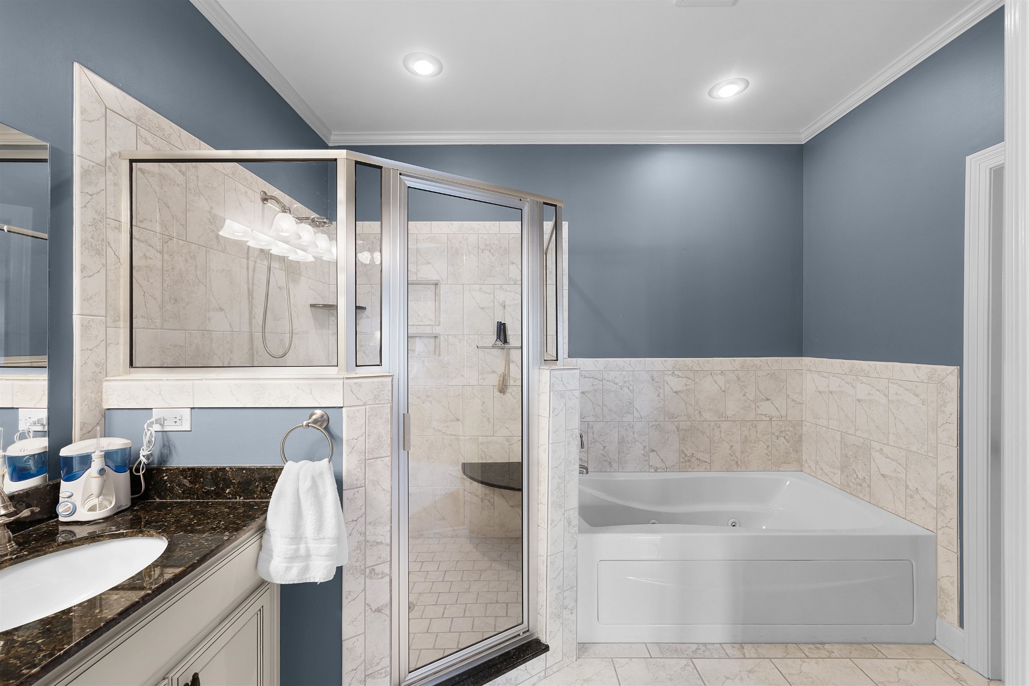 145 Deer Path Savannah, TN 38372 - Photo 14 of 23 a bathroom with a bathtub and a shower