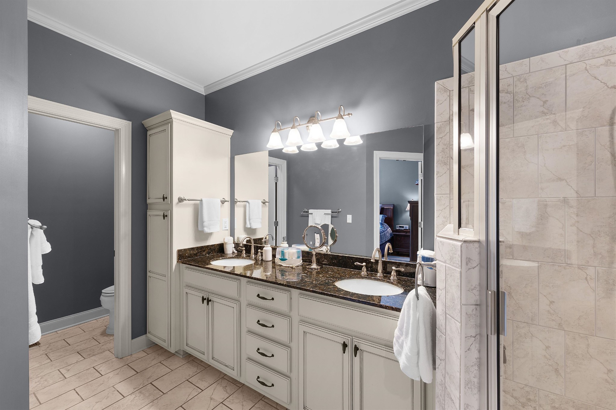 145 Deer Path Savannah, TN 38372 - Photo 15 of 23 a bathroom with a double vanity sink and a mirror