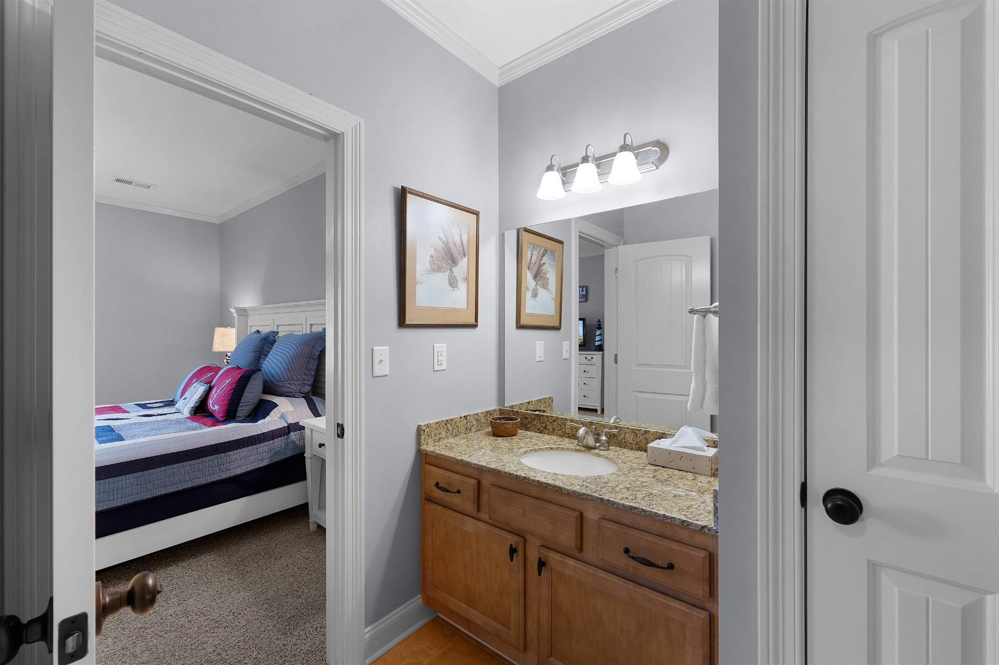 145 Deer Path Savannah, TN 38372 - Photo 17 of 23 a en suite bathroom with a double vanity sink and a mirror