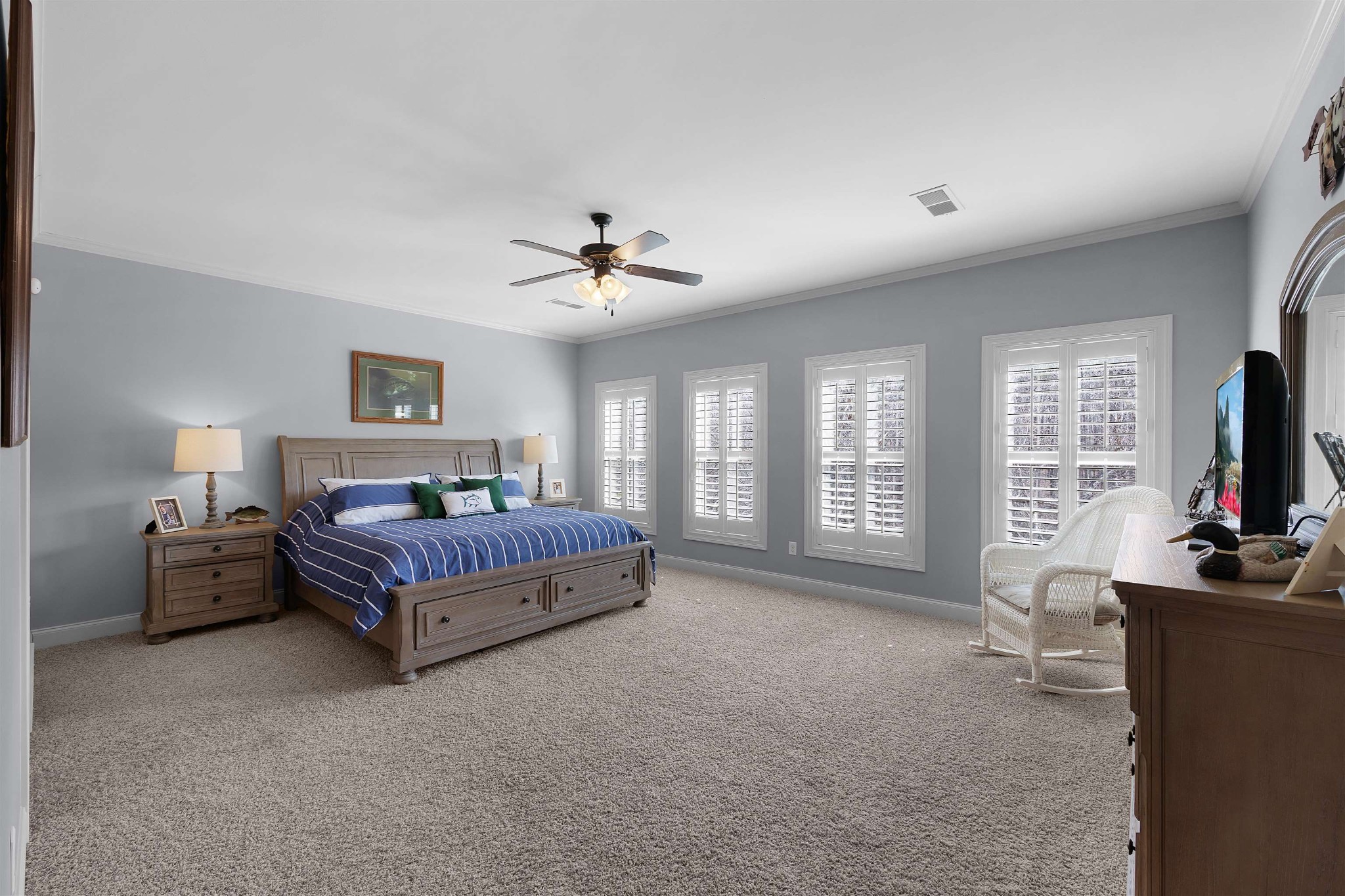 145 Deer Path Savannah, TN 38372 - Photo 18 of 23 a bedroom with a bed and a chandelier