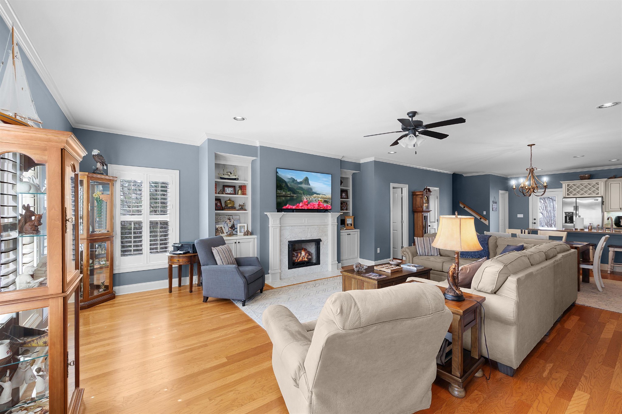 145 Deer Path Savannah, TN 38372 - Photo 3 of 23 a living room with fireplace furniture and a flat screen tv