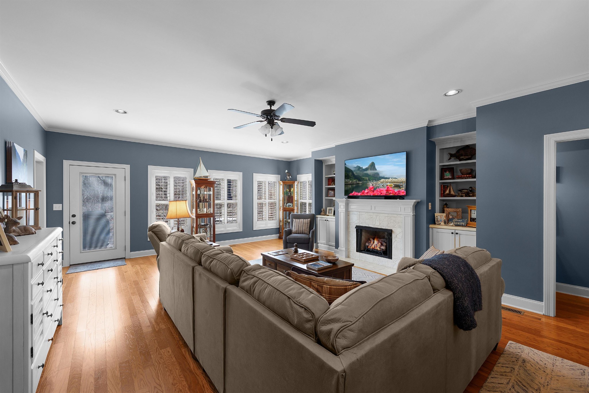 145 Deer Path Savannah, TN 38372 - Photo 4 of 23 a living room with fireplace furniture and a flat screen tv