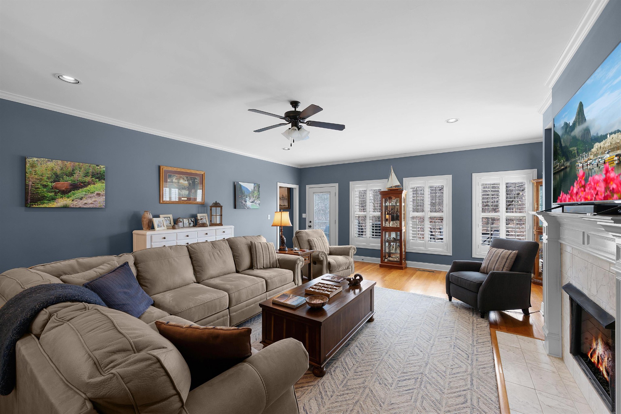 145 Deer Path Savannah, TN 38372 - Photo 5 of 23 a living room with furniture fireplace and a flat screen tv