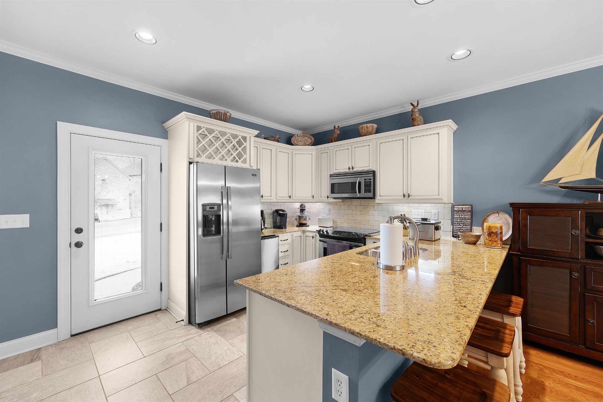 145 Deer Path Savannah, TN 38372 - Photo 8 of 23 a kitchen with kitchen island granite countertop a refrigerator a stove a sink a washer and island