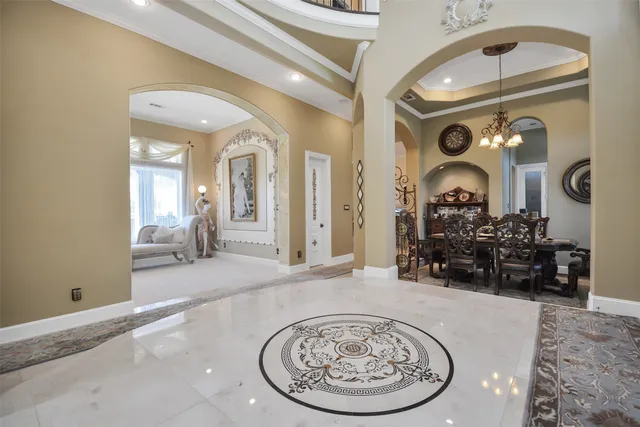 a view of a livingroom with furniture and a mirror