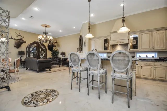 a kitchen with lots of counter top space and living room