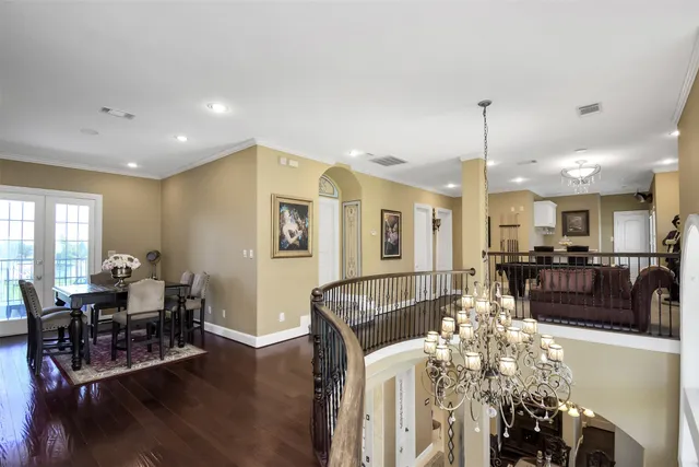 a room with furniture pool table and windows