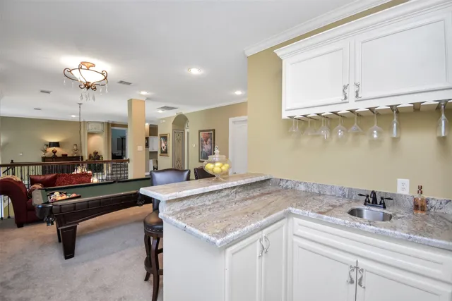 a room with painting on the wall and a window