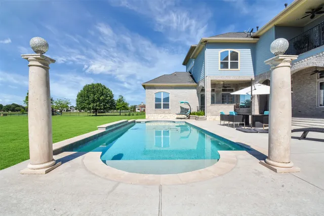 a view of a house with swimming pool