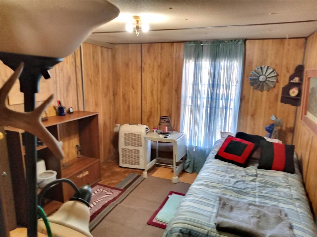 912-2357 2357th Meridian, TX 76665 - Photo 17 of 24 a bedroom with a bed and a couch