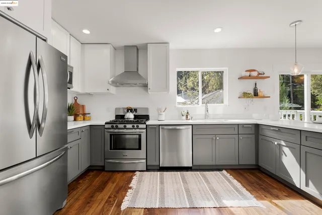 a kitchen with a refrigerator stove and sink