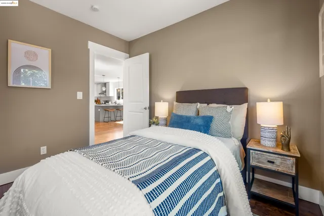 a bedroom with a bed and a dresser