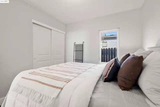 a bed room with a bed and a window