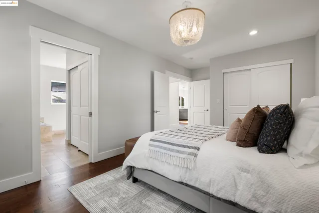 a spacious bathroom with a granite countertop sink a mirror and a