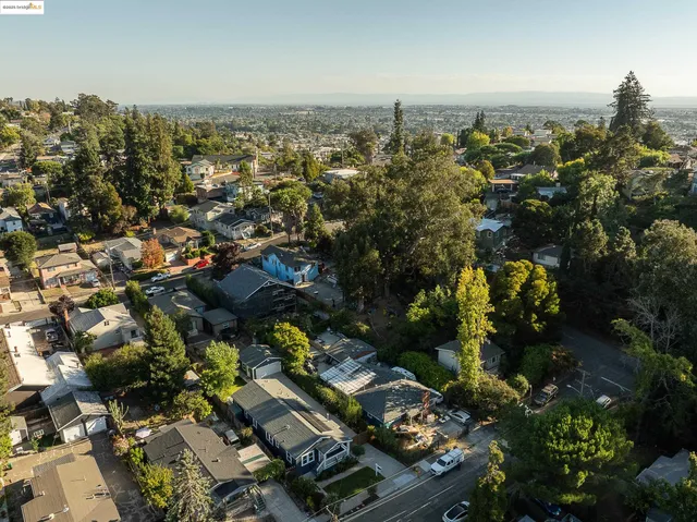 an aerial view of a house with lake view